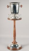 A PLATED AND WOOD ICE BUCKET ON MATCHING STAND. 30.5