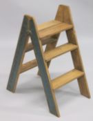 A PAIR OF NOVELTY WOODEN STEPS. 2ft 10ins high.