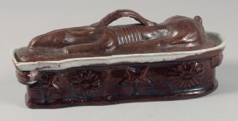 A HARE POTTERY TUREEN AND COVER. 10.5ins high.