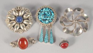 FOUR VARIOUS SILVER BROOCHES.