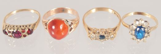 FOUR VARIOUS GOLD RINGS.