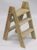 A PAIR OF NOVELTY WOODEN STEPS. 2ft 10ins high.
