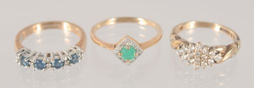 THREE VARIOUS GOLD RINGS.