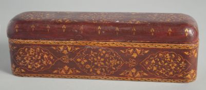 A TURKISH ISLAMIC PEN BOX, with floral decoration, 27.5cm long.