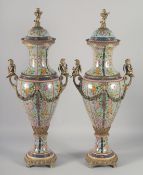 A PAIR OF IMPRESSIVE PORCELAIN AND ORMOLU MOUNTED VASES AND COVERS, the bodies decorated with
