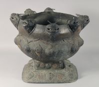 AN UNUSUAL CHINESE MARKET METALWORK CENTRE PIECE, with European stamp, standing on a fitted square