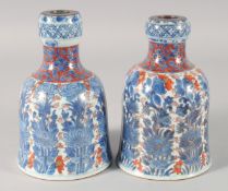 A PAIR OF 18TH CENTURY CHINESE IMARI DECANTERS, KANGXI PERIOD, painted with floral columns and