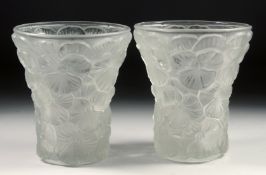 A PAIR OF LALIQUE GLASS VASES each with a moulded flower head design. 5.75ins high.