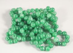 A JADE BEAD NECKLACE. 136cm long