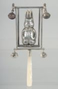 A SILVER MOTHER OF PEARL PETER RABBIT RATTLE.