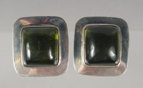 A PAIR OF SILVER DESIGNER CLIP EARRINGS.