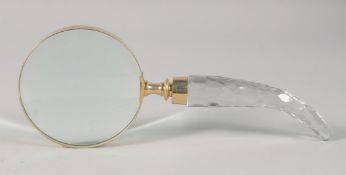 A MAGNIFYING GLASS with cut glass handle.