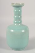 A CHINESE CELADON GLAZE VASE, with ribbed neck, 25.5cm high.