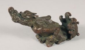 A JAPANESE BRONZE OKIMONO OF A DRAGON, the base with character mark, 8cm wide.