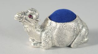 A SILVER-PLATED CAMEL PIN CUSHION. 5cm