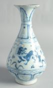 A CHINESE BLUE AND WHITE YUHUCHUN VASE, painted with foo dogs, 30cm high.