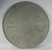 A VERY LARGE OTTOMAN ARMENIAN TINNED COPPER TRAY, with central inscribed panel, 89cm diameter.