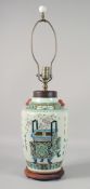 A CHINESE PORCELAIN VASE LAMP with turned wood base. 28ins high. including shade fitting.