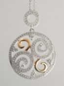 A GOOD 18CT DIAMOND SWIRL OPEN WORK PENDANT AND CHAIN.