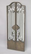A WROUGHT IRON GATE STYLE FOLDING MIRROR. Open size 4ft 11ins high x 4ft wide.