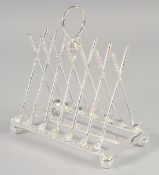 A NOVELTY PLATED TOAST RACK MODELLED AS GUNS.