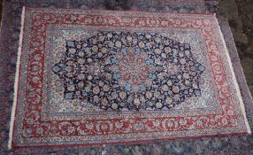 A GOOD PERSIAN CARPET, rust ground with stylised floral decoration. 10'2