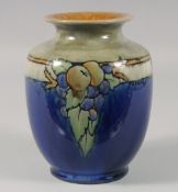 A ROYAL DOULTON BLUE VASE painted with flowers and fruit.