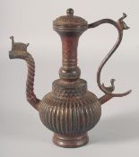 AN INDIAN BRONZE LIDDED EWER, the handle and spout with birds, 23.5cm high.