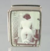 A SILVER AND ENAMEL NUDE PILL BOX. 3cm