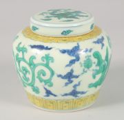 A CHINESE SANCAI PORCELAIN 'KUI DRAGON' GINGER JAR AND COVER, 12cm high.