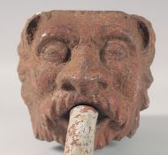 A GEORGIAN CAST IRON LION HEAD WALL FOUNTAIN.