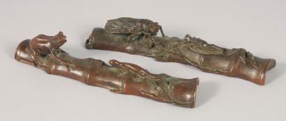 A PAIR OF BRONZE PAPERWEIGHTS, one formed as an insect on bamboo, the other as a frog on bamboo,