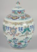A CHINESE DOUCAI PORCELAIN GINGER JAR AND COVER, decorated with lotus and auspicious symbols, the