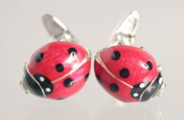A PAIR OF SILVER AND ENAMEL LADY BIRD CUFFLINKS.