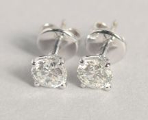 A GOOD PAIR OF SINGLE STONE DIAMOND EARRINGS, approx. .75 carat each.