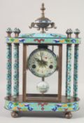 A DECORATIVE BRONZE AND CLOISONNE ENAMEL PILLAR MANTEL CLOCK with urn finial. 18ins high.