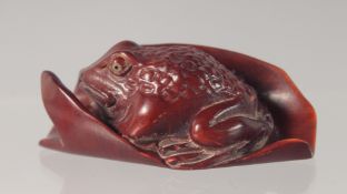 A CARVED WOOD NETSUKE modelled as a bat. 5.5cm long.