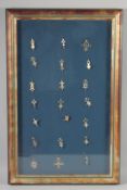 A FRAMED COLLECTION OF CROSSES.
