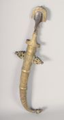 AN ISLAMIC DAGGER, with brass and possibly silver scabbard, 42cm long.