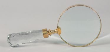 A MAGNIFYING GLASS with cut glass handle.