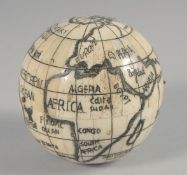 A BONE GLOBE SHAPED FOLDING COMPASS.