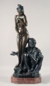 A GOOD LARGE BRONZE OF A STANDING FEMALE NUDE, with an Arab man seated by her side. 27ins high.