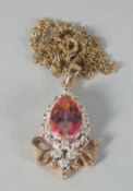 A 9ct. TOPAZ AND DIAMOND PENDANT AND CHAIN.
