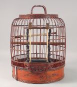 A CHINESE WOODEN BIRD CAGE. 15ins long.
