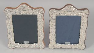 A PAIR OF VICTORIAN STYLE SILVER PHOTOGRAPH FRAMES. 7.75