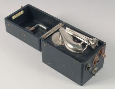 A VICTORIAN MINIATURE WIND UP GRAMOPHONE in a leather case.