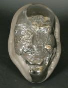Wayne D Filan (American, born 1946) Two highly unusual silvered opaque glass sculptures of head