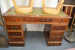 A reproduction mahogany twin pedestal desk.