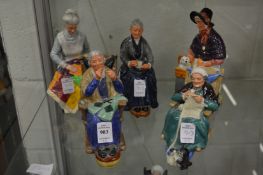 A group of five Royal Doulton figures.