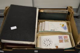 A quantity of first day covers and stamps in albums.